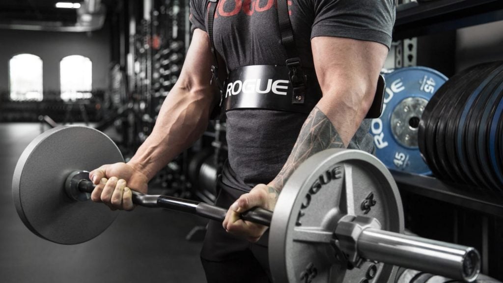 man performing ez bar curls