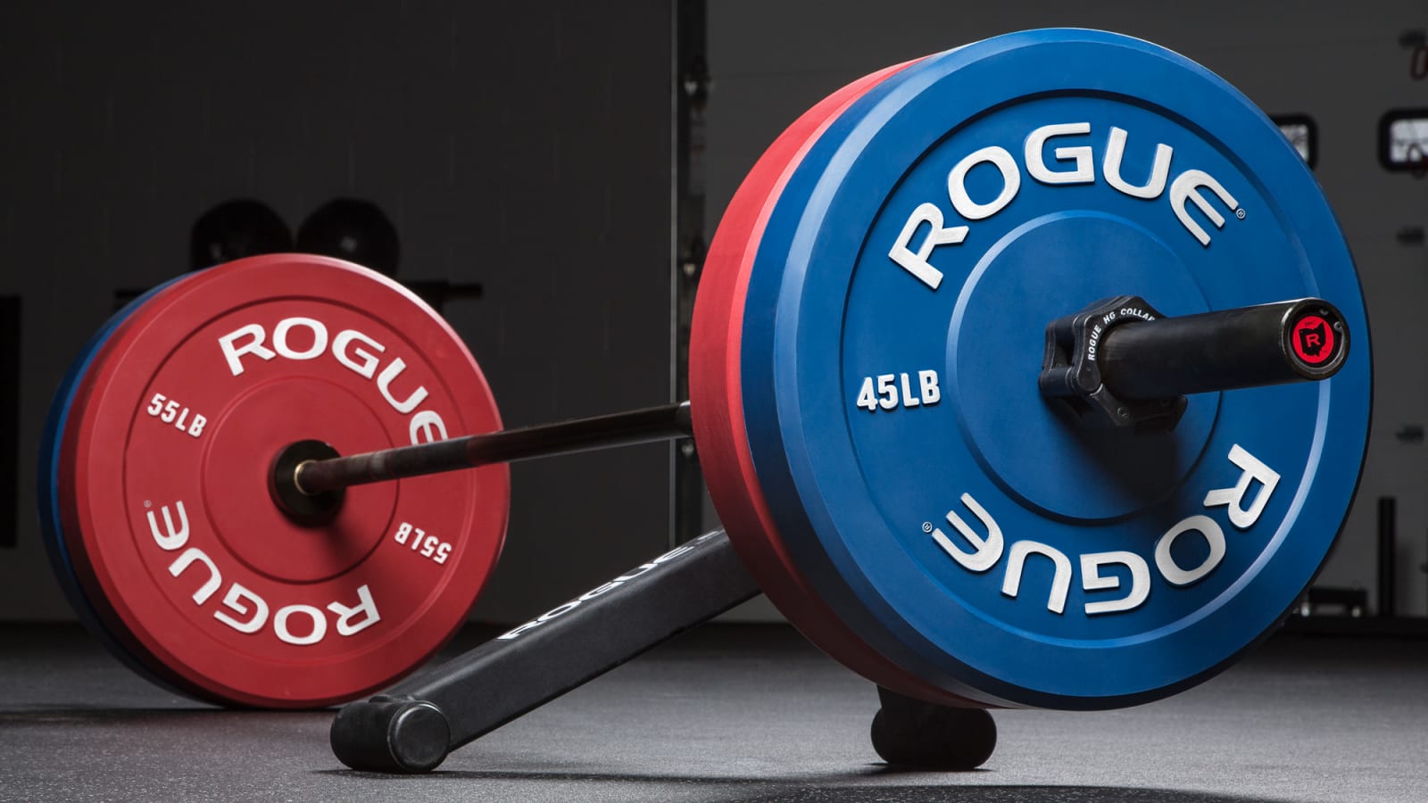 rogue echo bumper plates loaded on barbell with barbell jack lifting one side