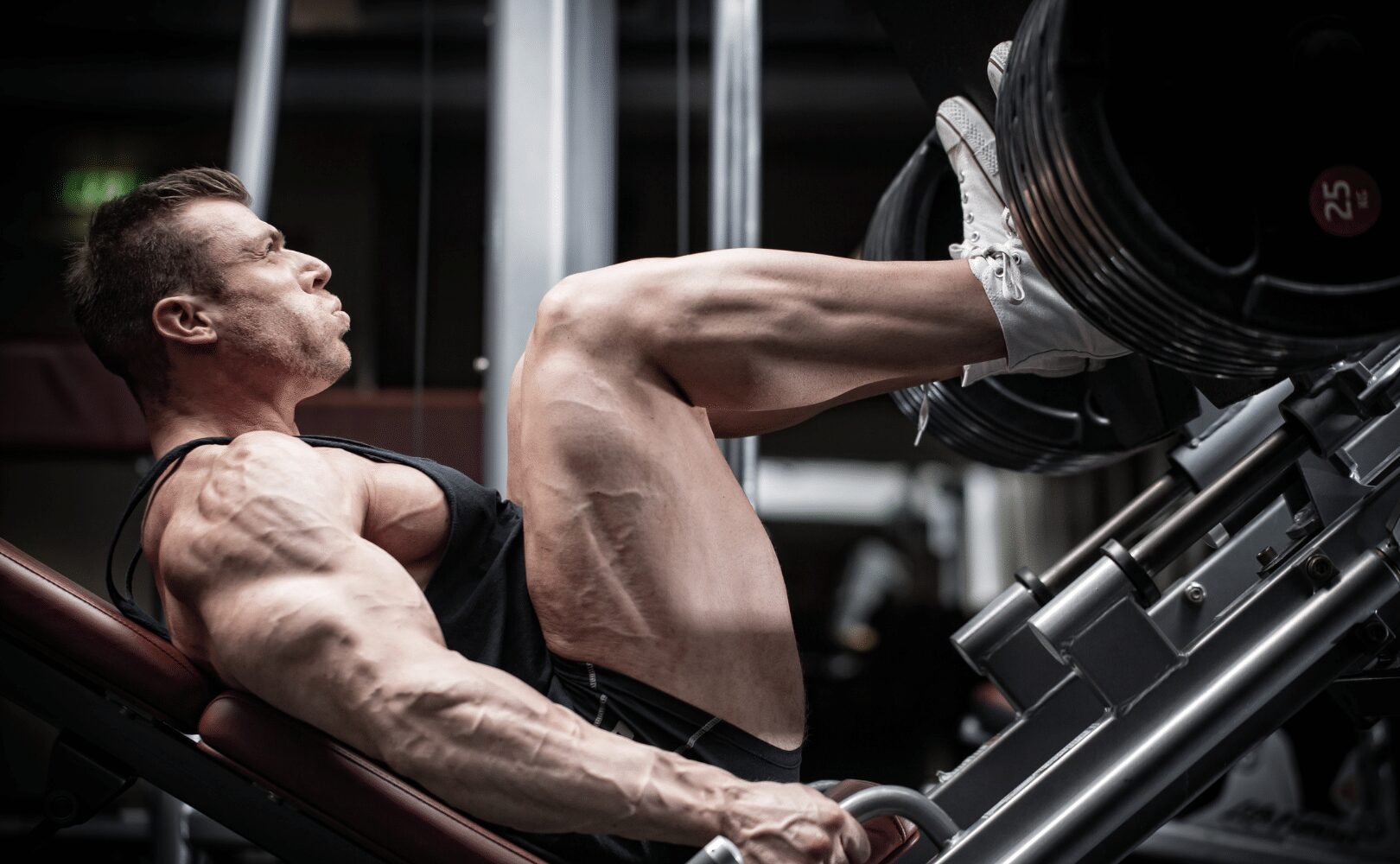muscular man performing the leg press
