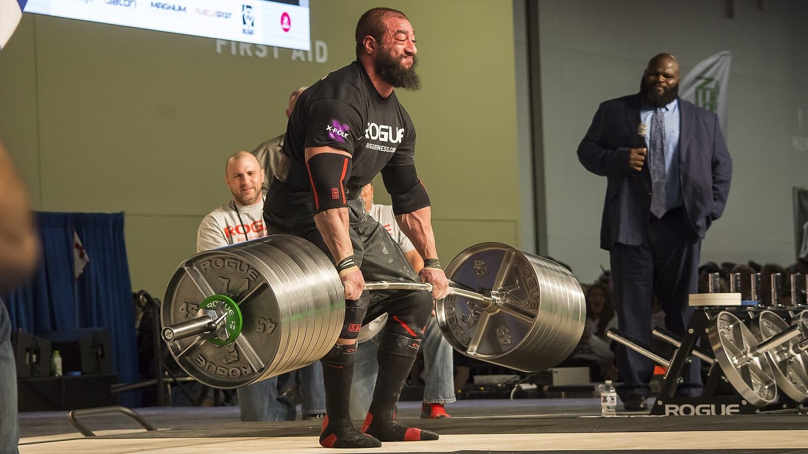 zach hadge performing a strongman style deadlift with the rogue elephant bar