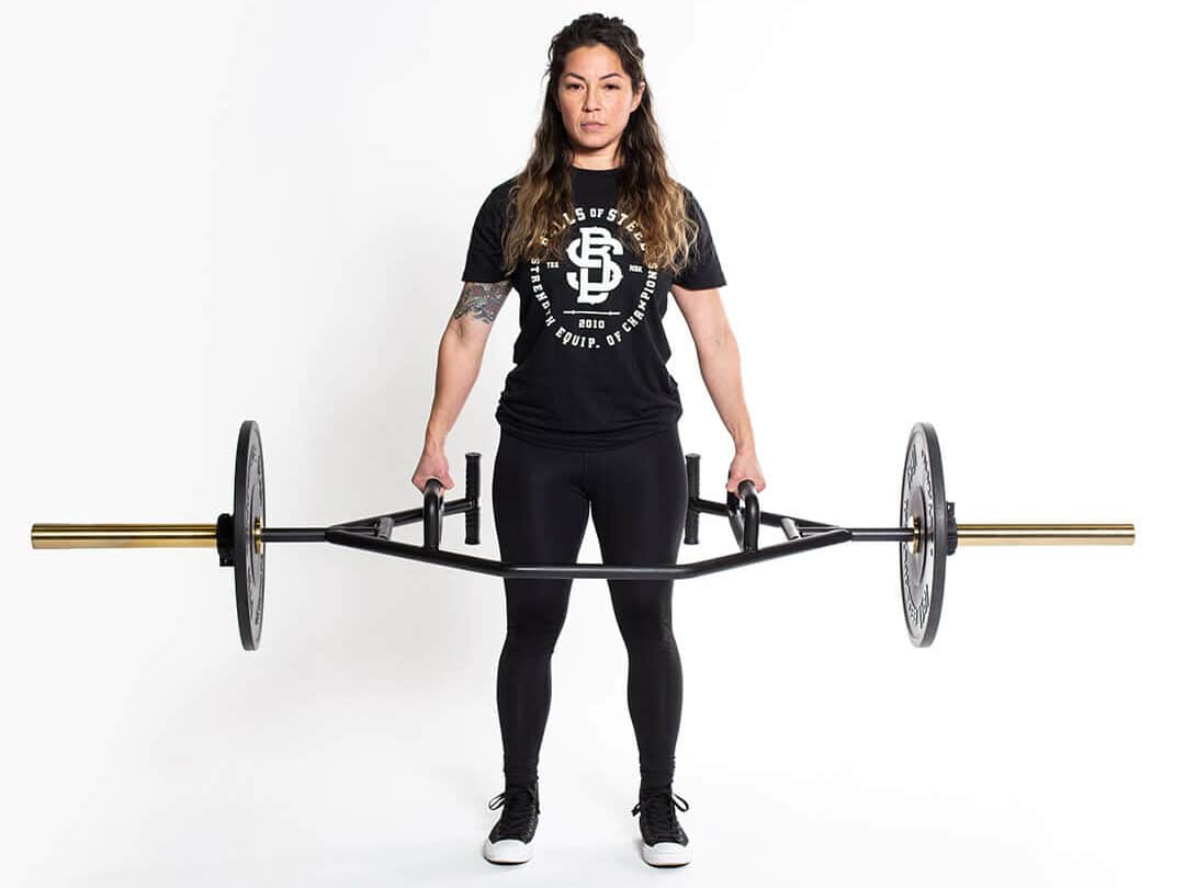 woman doing deadlifts with a rackable trap bar