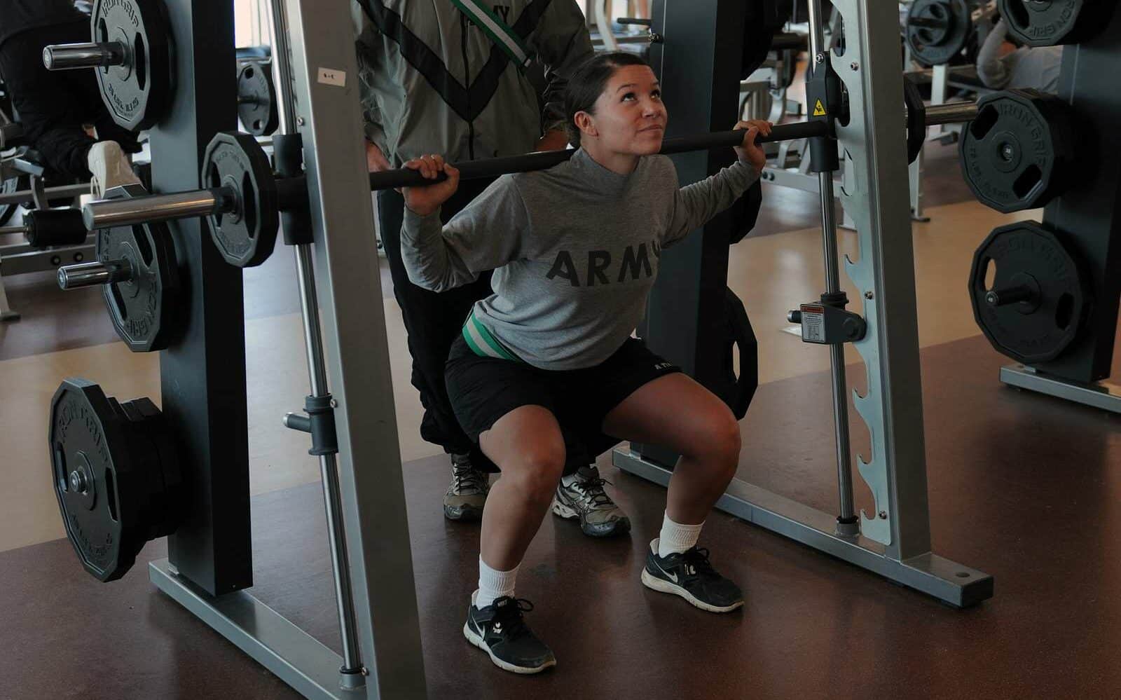 US Army Sgt. Melissa Schimmel performing using the smith machine for squats