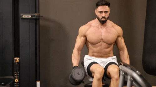 man doing seated lateral raises