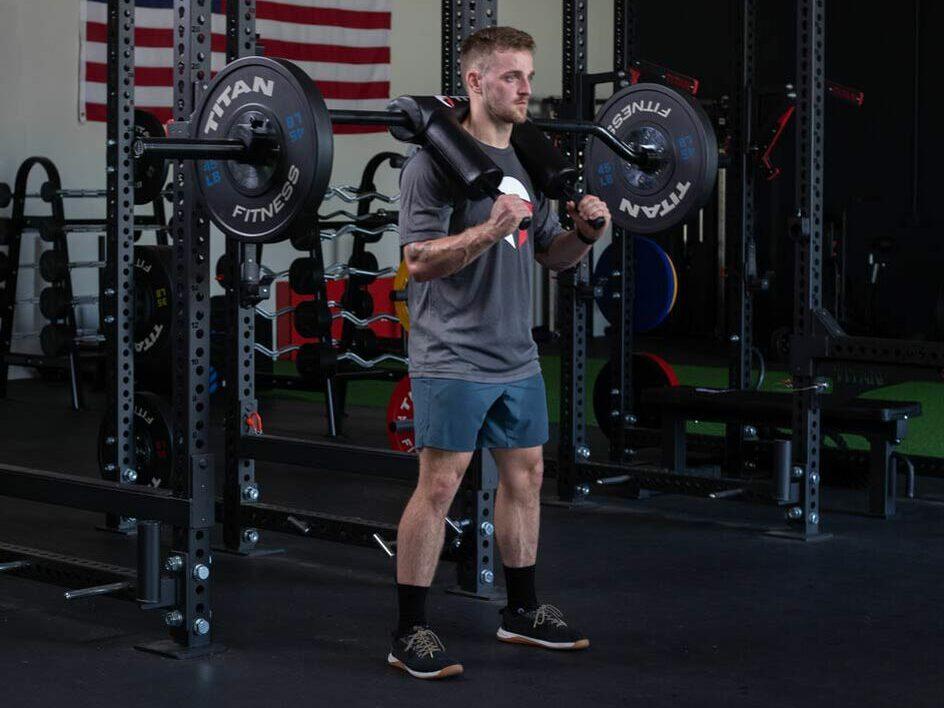 man about to squat with safety squat bar