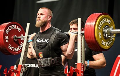 man squatting with ohio power bar