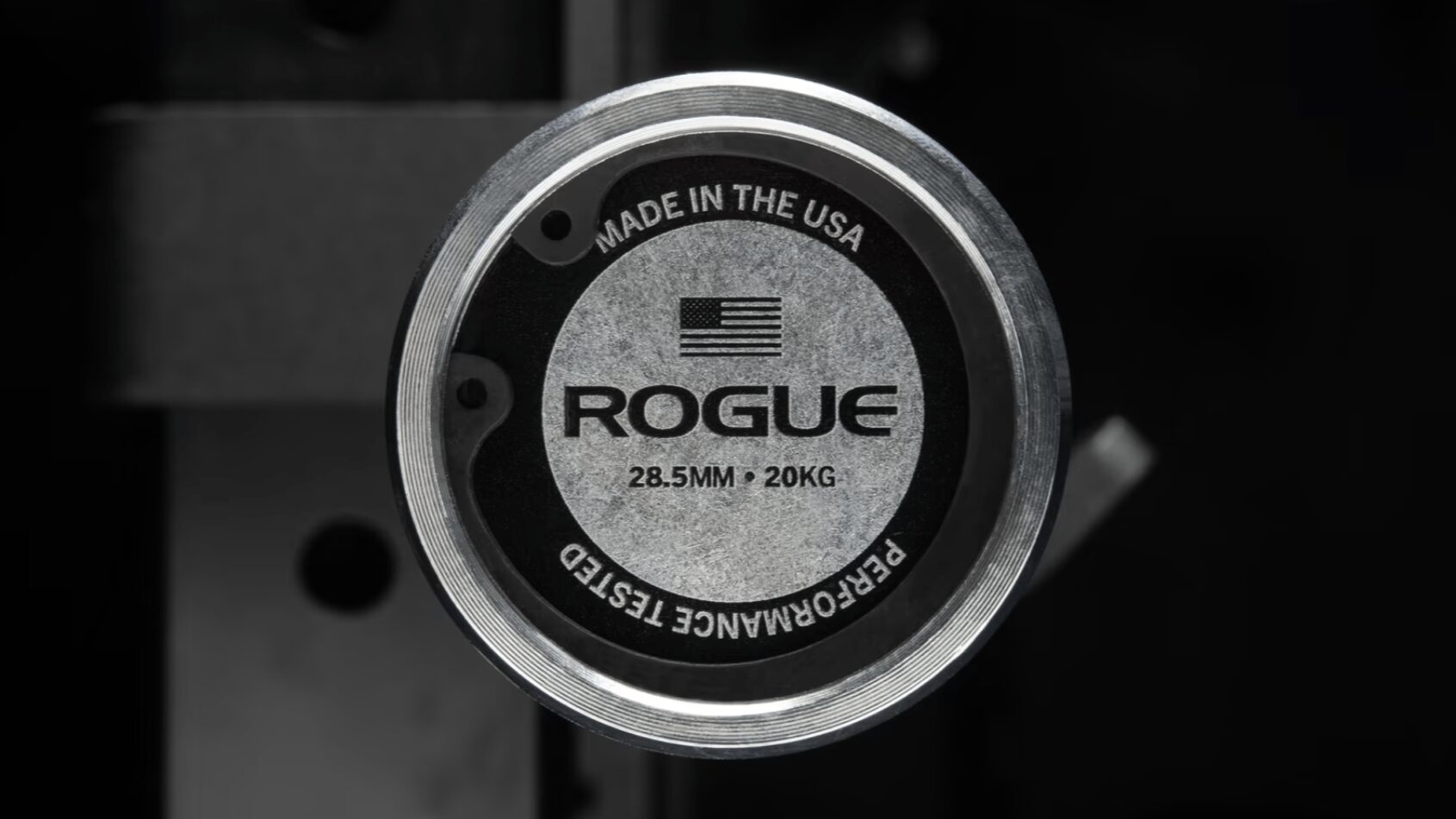 rogue barbell endcap showing the weight of the bar