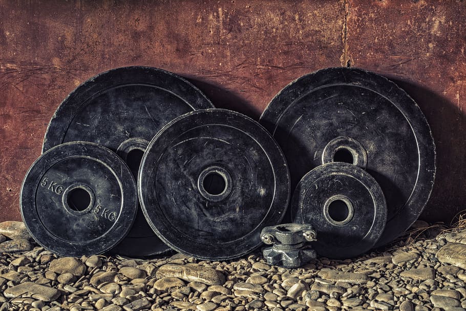 dusty black weight plates one of which is 5kg