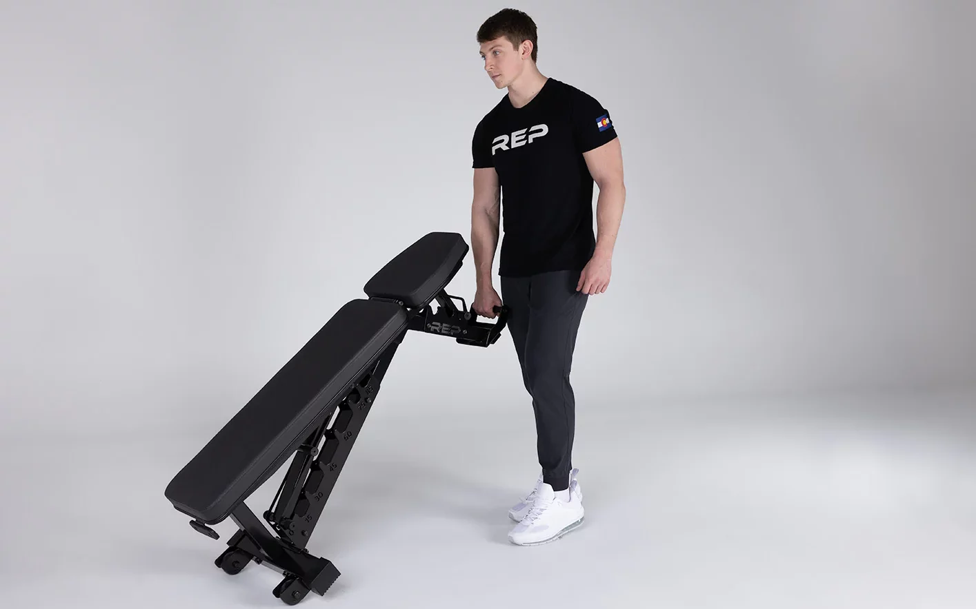 man moving the ab-4100 bench